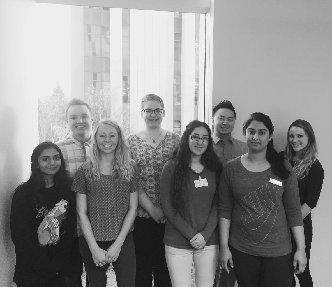 An image of the group of second year students holding a book drive as part of their clinical practicum with Calgary Reads.