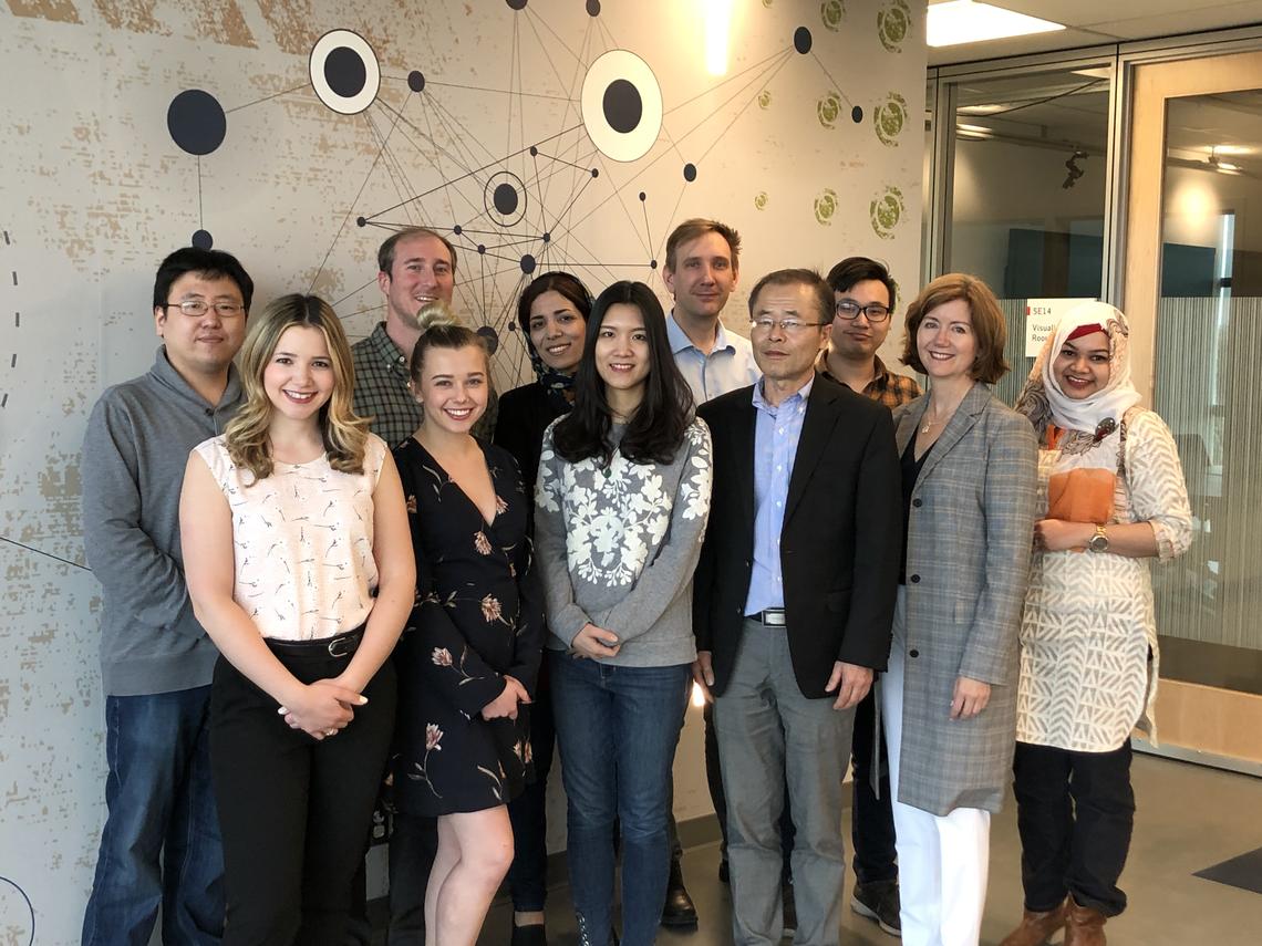 Quan (first row, third from right) poses with the group from the Centre for Health Informatics.