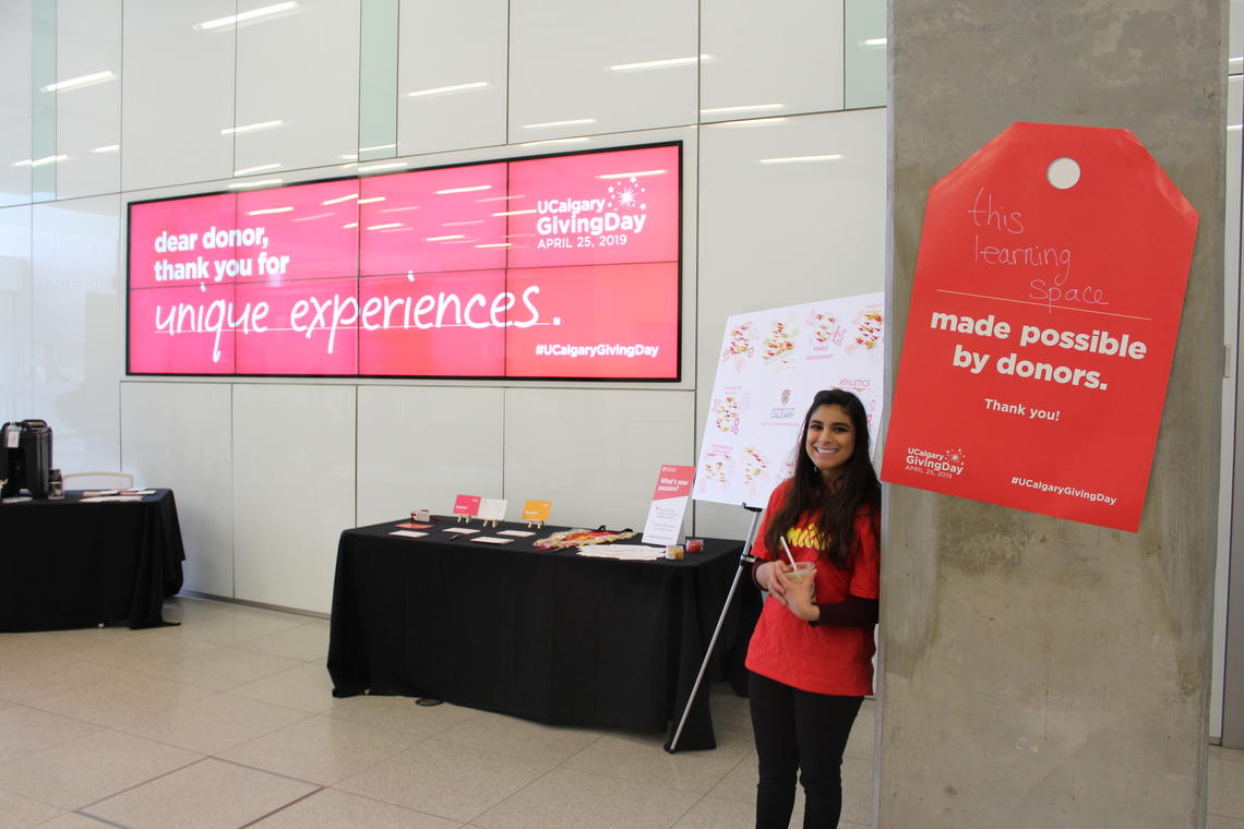 Volunteer Hafsa Gora set up shop in the Taylor Family Digital Library.