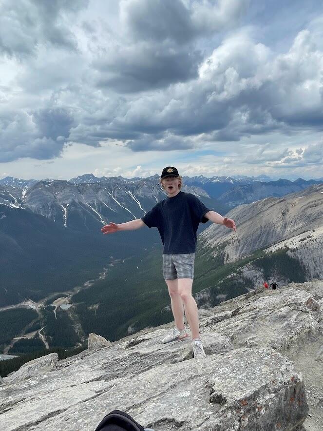 Young man hiking on mountain