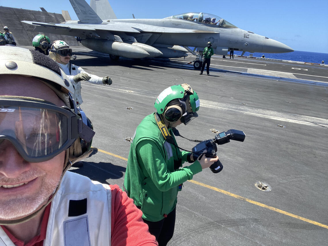 Prof Brodie observes a carrier launch from the flight deck of USS CARL VINSON