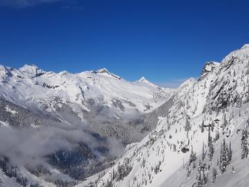 Snow-covered mountain range, where wolverines often make their habitats.