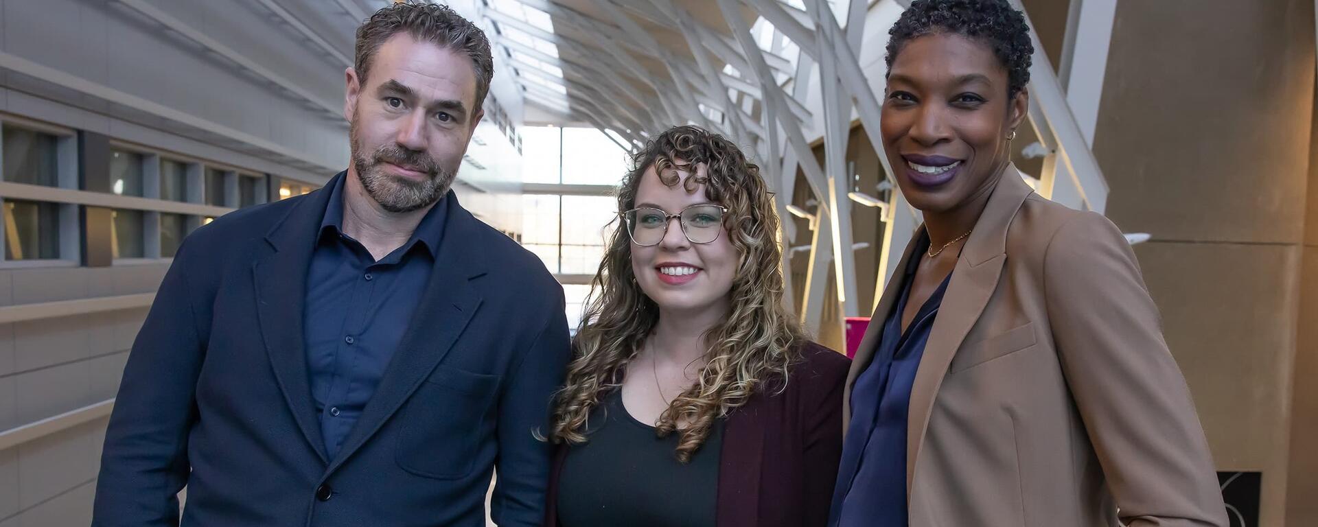 Dr. Matthew Hill, Dr. Leah Mayo and Dr. Araba Chintoh stand side by side, facing at the camera.