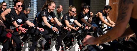 A group of people on spin bikes.